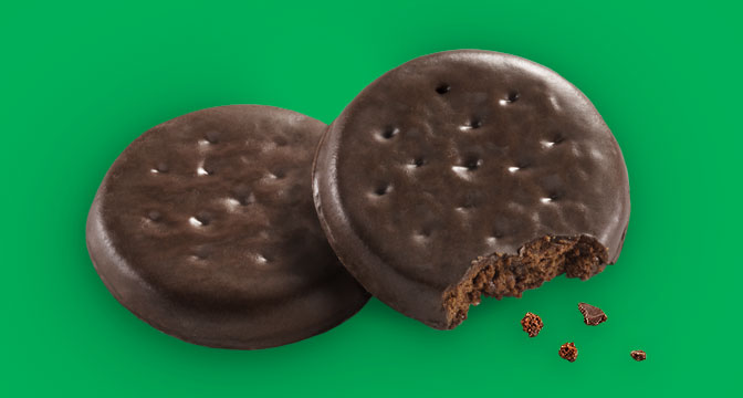 This is a guide to Girl Scout Cookies that are vegan and how to buy Girl Scout Cookies in 2021. For more vegan food, visit www.vegansbaby.com. This photo is of Thin Mints, mint cookie covered in chocolate.